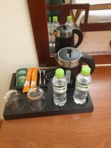 a tray with two bottles of water on a table at Ngọc Lan Hotel in Ho Chi Minh City