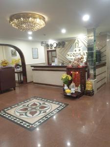 a lobby with a restaurant with a counter and a room at Ngọc Lan Hotel in Ho Chi Minh City