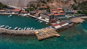 an aerial view of a harbor with boats in the water at Assos Troy Port Hotel in Behramkale