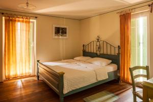 a bedroom with a bed and a window at KABAJ Wine & Dine in Dobrovo +26 photos