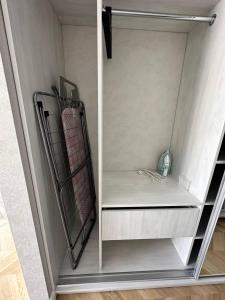 a small closet with a shelf and a shelf at Apartment 2, Podillya, новобудова in Vinnytsya +4 photos