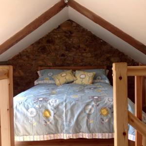 a bedroom with a bed in a roof at The Blacksmith's Shop in Port Isaac