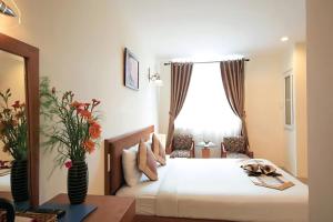 Postel nebo postele na pokoji v ubytování Bunny - Valentine Hotel - Bui Vien Street