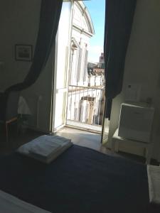 A bed or beds in a room at I DIOSCURI