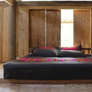 מיטה או מיטות בחדר ב-Mường Lò Corner