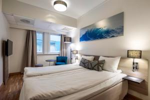Postel nebo postele na pokoji v ubytování Quality Hotel Saga