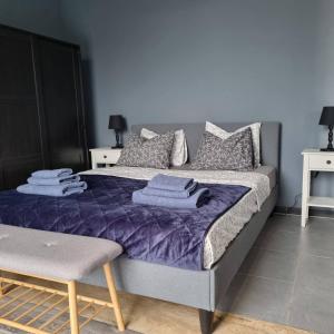 a bedroom with a bed with purple sheets and pillows at Villa INTERMEZZo 11 sea view in Neoi Epivates