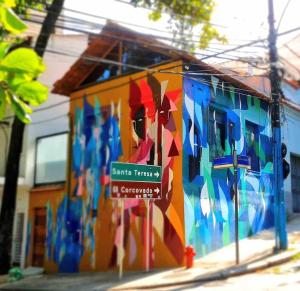 a building with a painting on the side of it at Santa Cabana - Rio de Janeiro in Rio de Janeiro