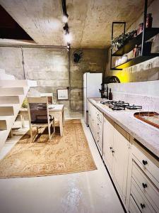 a kitchen with a stove and a table in it at Santa Cabana - Rio de Janeiro in Rio de Janeiro +25 photos