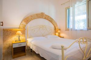 Postel nebo postele na pokoji v ubytování Agriturismo Le Tagliate