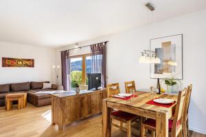 a living room with a table and a couch at Südalb in Albstadt