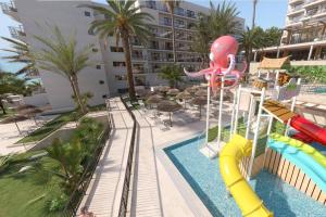a pool with a slide and a water park at Hotel Best Triton in Benalmádena