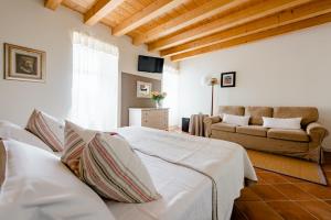 Postel nebo postele na pokoji v ubytování B&B POGGIO CAIAR + 49 fotografií