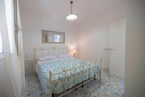Postel nebo postele na pokoji v ubytování Agriturismo Le Tagliate