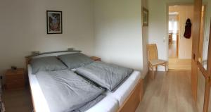 Postel nebo postele na pokoji v ubytování Hexenstube-Evanora-Kurparkblick