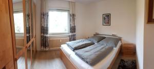 Postel nebo postele na pokoji v ubytování Hexenstube-Evanora-Kurparkblick