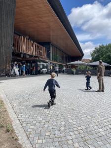 two young boys riding skateboards in front of a building at Ferienwohnungen im Haus Waldstück in Lärz +39 photos