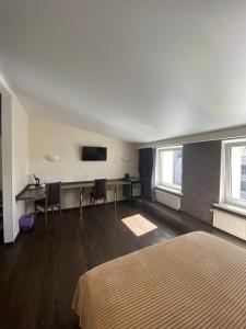 TV a/nebo společenská místnost v ubytování Afina Aparthotel