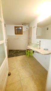 a bathroom with a counter and a sink in a room at CABANON TIMANTHE in Canari