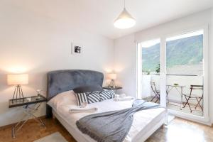 Giường trong phòng chung tại Nice apartment ideally located in Martigny