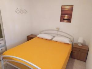 Ένα ή περισσότερα κρεβάτια σε δωμάτιο στο Appartamento Pagoda