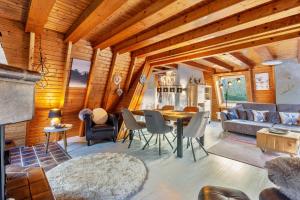 a living room with a table and a couch at Villa Natura in Meschede