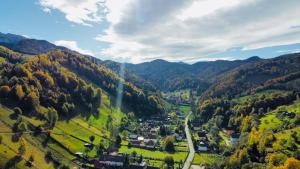 a small town in a valley in the mountains at Hillden Lodge &Restaurant in Bran