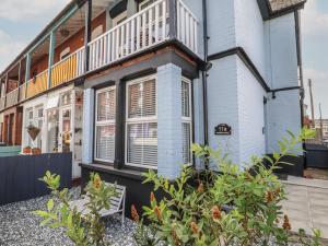 a house with a balcony on top of it at 11a Manning Road in Felixstowe