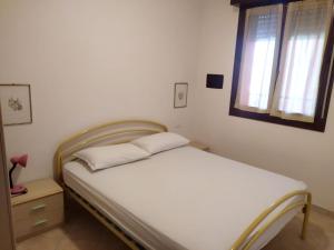 Postel nebo postele na pokoji v ubytování Residence Corallo