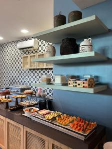 a buffet line with many different types of food at Fortpraia Hotel in Fortaleza