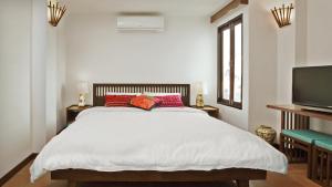 Ein Bett oder Betten in einem Zimmer der Unterkunft Green Tiger House