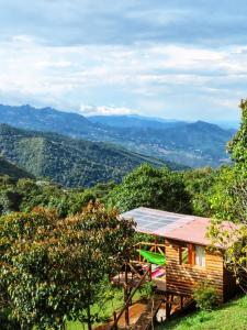 a house on a hill with a view at Entre Arboles Cali in Cali +12 photos