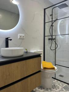 a bathroom with a sink and a toilet and a shower at Casa Rodasa - 2 bedrooms, roof terrace, Airco, Front-terrace, Back-Patio, communal pool, etc in Roda
