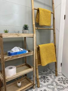 a ladder shelf in a bathroom with towels at Casa Rodasa - 2 bedrooms, roof terrace, Airco, Front-terrace, Back-Patio, communal pool, etc in Roda