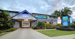 a building with a hallway leading to a parking garage at Fitzroy Motor Inn in Grafton