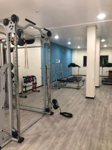 a gym with several exercise equipment in a room at 122-Alquiler Deptos Complejo SummerBeach Bombinhas in Bombinhas