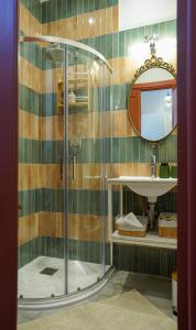 a bathroom with a shower and a sink at Malta Luxe Guest Suite Central Location in Mosta
