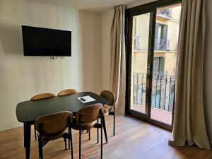 TV a/nebo společenská místnost v ubytování Rambla de Mar Apartments