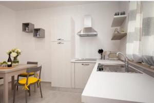 Køkken eller tekøkken på Holiday House Monalisa