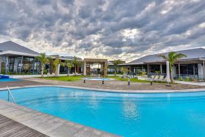 a large blue pool in front of a resort at Ballito Hills 169 in Ballito