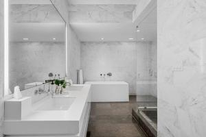 a white bathroom with two sinks and a tub at BOULAN HOTEL MIAMI BEACH BY IMD MIAMI 1BR/1BA UNIT in Miami Beach