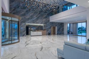 a lobby of a building with a marble floor at Grand Elis Hotel & Spa Resort 
