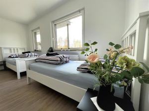 a bedroom with two beds and a window at GL-Oberkülheim in Bergisch Gladbach