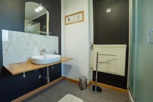 a bathroom with a sink and a mirror at Apartments Silva in Ljutomer