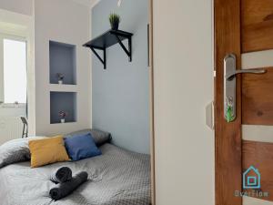 a bedroom with a bed and a black door at World Room in Gdańsk