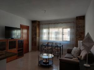 a living room with a couch and a table at Mi isla bonita in Arrecife