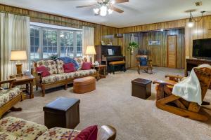 a living room filled with furniture and a piano at Vintage Chipley Getaway on Large Private Property in Chipley