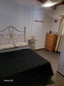 Giường trong phòng chung tại Alojamiento Casa Malbec