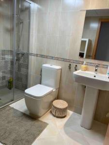 a bathroom with a shower and a toilet and a sink at Casa Calinka in Sant Jordi
