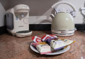 a counter with a mixer and a plate of food at Number 4 in Fort William +6 photos